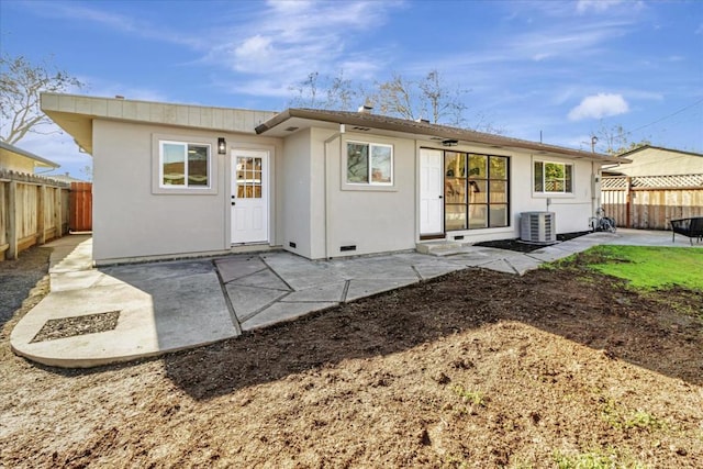 rear view of house featuring a patio area and central air condition unit