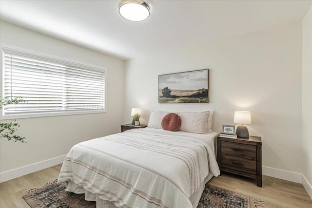 bedroom with light wood-type flooring