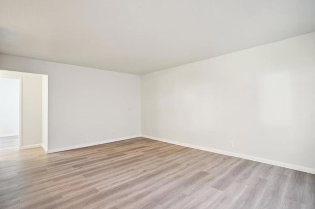 unfurnished room featuring light hardwood / wood-style floors