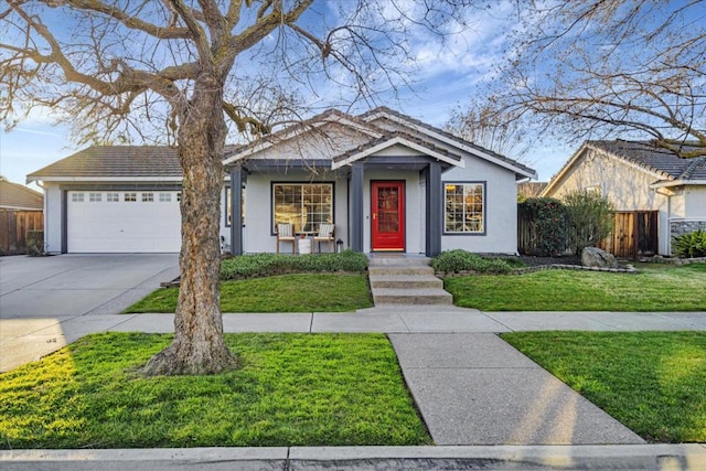 view of front of home with a garage and a front yard