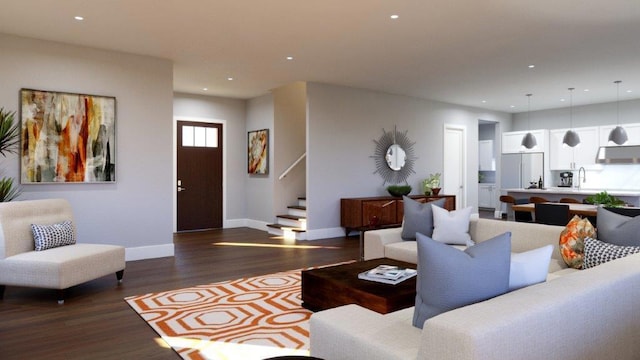 living room featuring sink and dark wood-type flooring