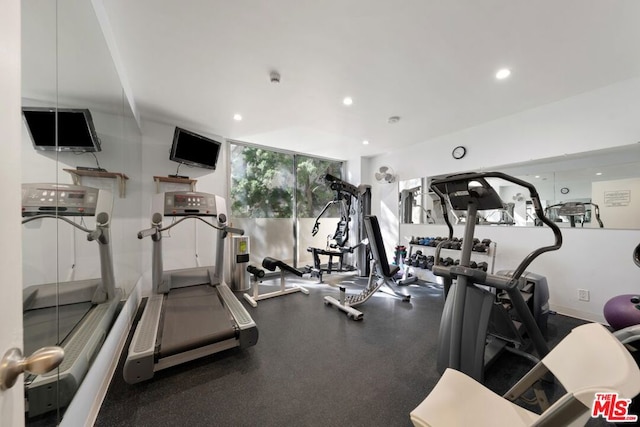 workout area with a wall of windows