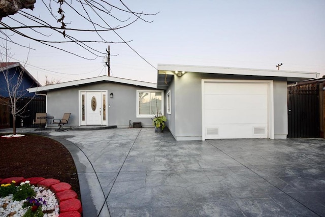 ranch-style home featuring a garage