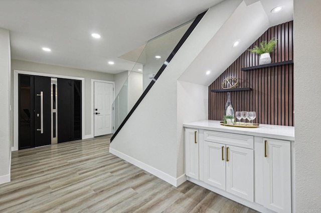 bar featuring recessed lighting, light wood-type flooring, and baseboards