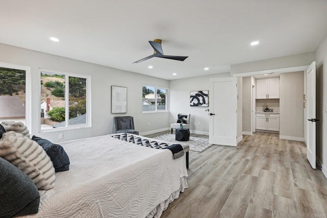 bedroom featuring light wood-type flooring, recessed lighting, ceiling fan, and baseboards