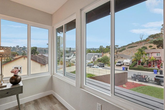 unfurnished sunroom with a residential view