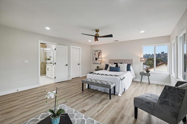 bedroom with light wood-style floors, recessed lighting, visible vents, and baseboards