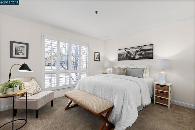 carpeted bedroom featuring crown molding