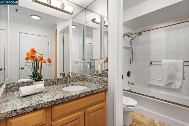 full bathroom with tile patterned floors, toilet, vanity, ornamental molding, and enclosed tub / shower combo