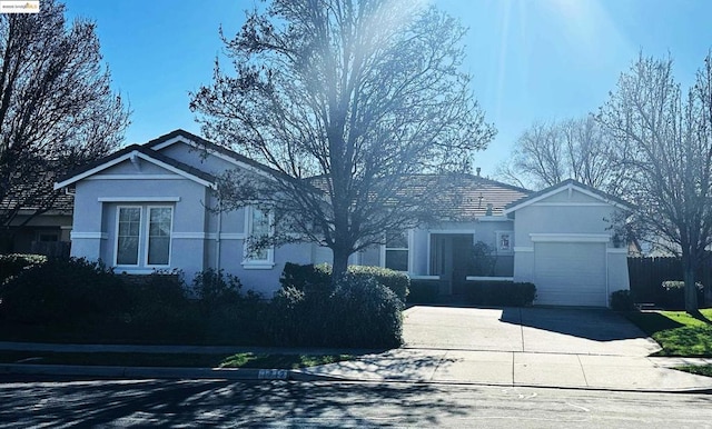 single story home with a garage