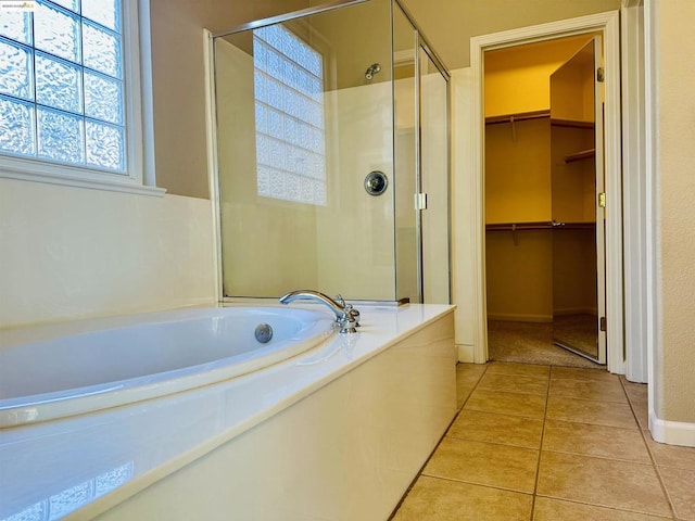 bathroom with plus walk in shower and tile patterned flooring