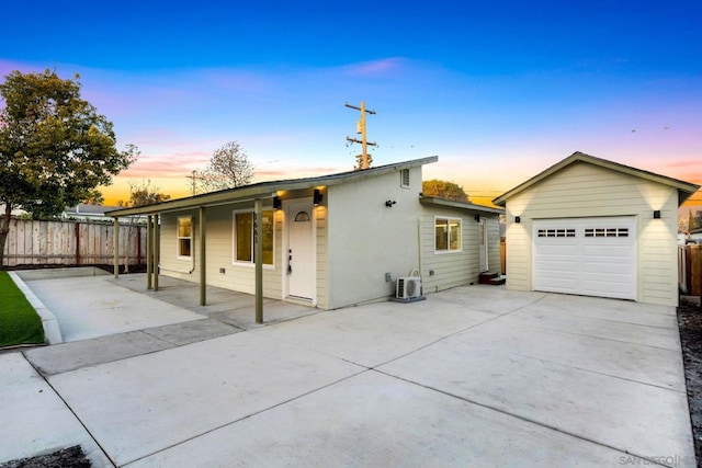 view of front facade featuring an outbuilding and a garage