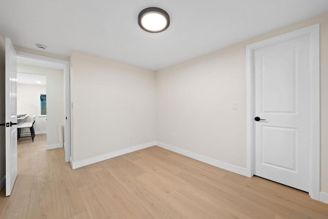 unfurnished room with light hardwood / wood-style flooring