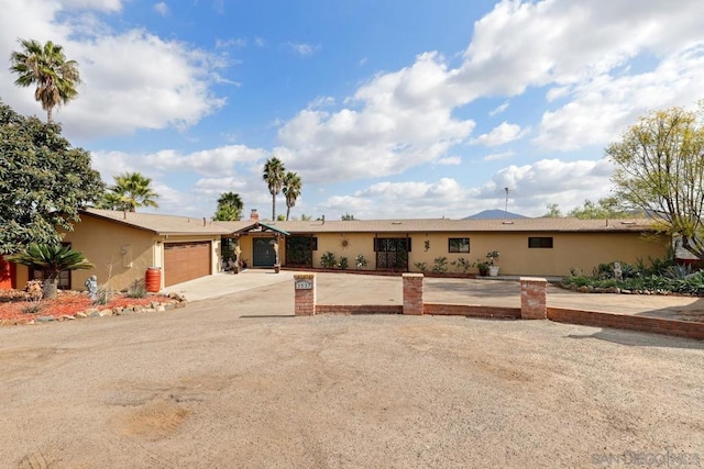 ranch-style home featuring a garage