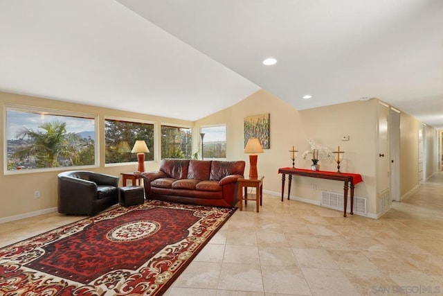 tiled living room with vaulted ceiling