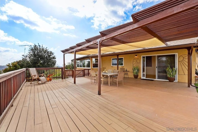 wooden deck featuring a pergola