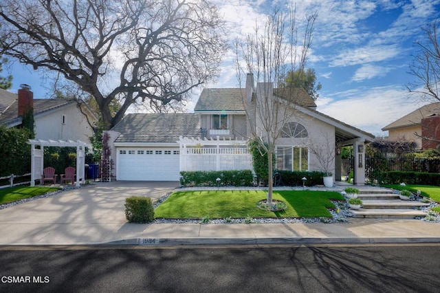 view of front of house with a garage and a front lawn