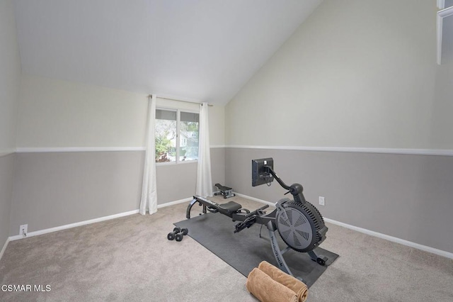 workout area featuring carpet and lofted ceiling