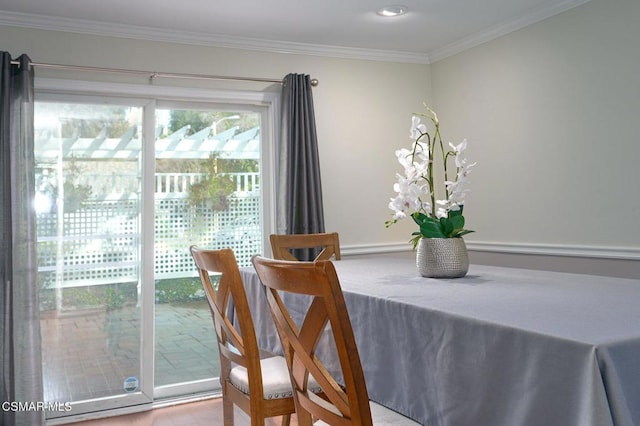 dining room featuring ornamental molding