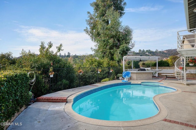 view of pool with an in ground hot tub and a patio