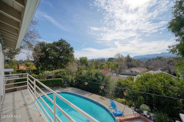 view of swimming pool featuring a mountain view