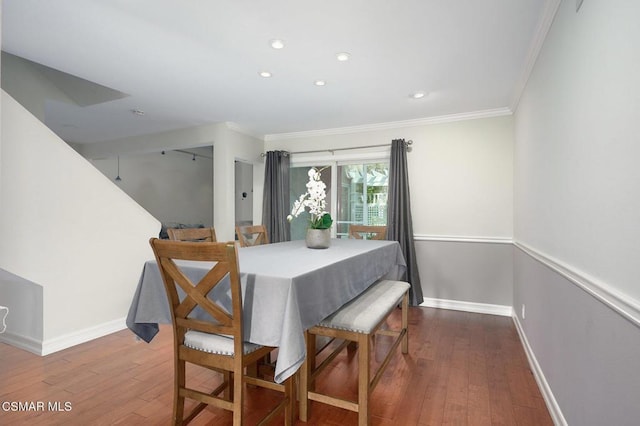 dining area with ornamental molding and wood-type flooring