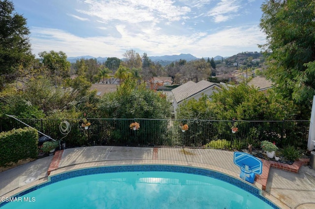 view of pool with a mountain view