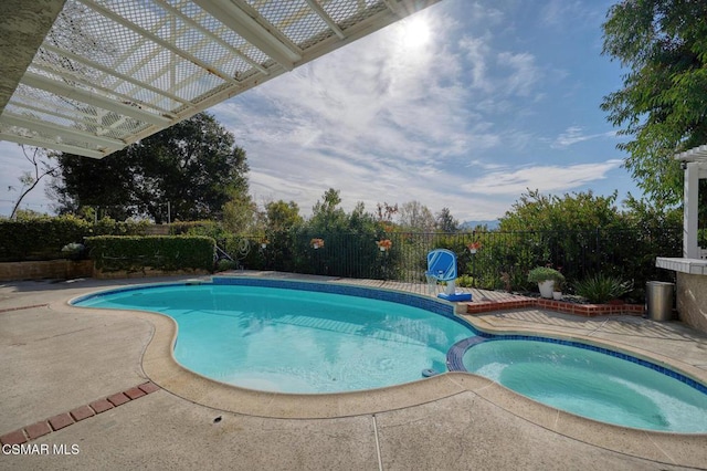 view of pool featuring an in ground hot tub, a patio, and a pergola