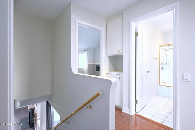 hallway with light hardwood / wood-style flooring