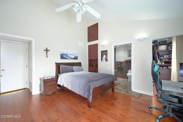 bedroom with dark wood-type flooring, connected bathroom, and high vaulted ceiling