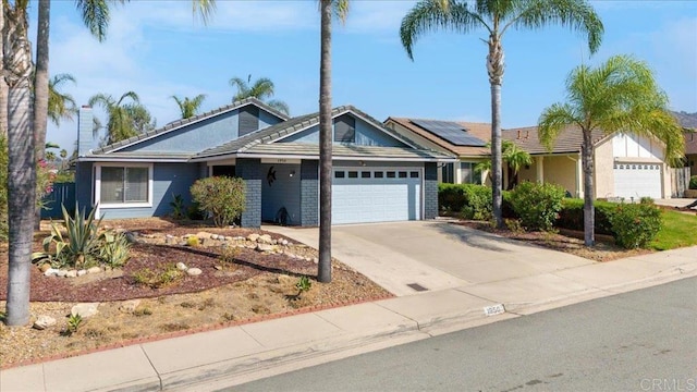 ranch-style house with an attached garage and driveway