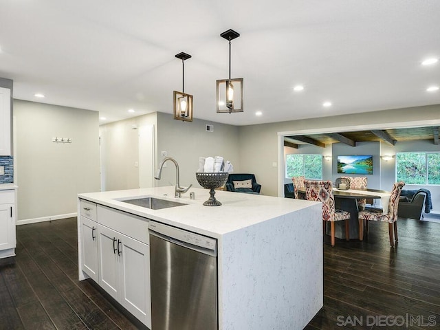 kitchen with white cabinetry, dishwasher, sink, hanging light fixtures, and a kitchen island with sink