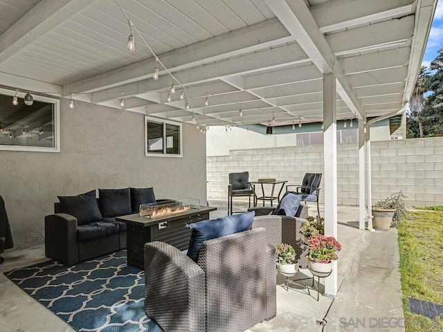 view of patio featuring an outdoor living space with a fire pit