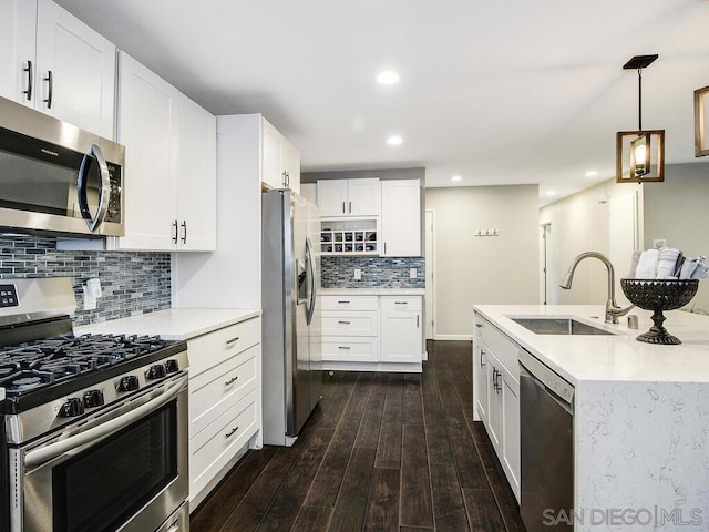 kitchen featuring white cabinetry, stainless steel appliances, dark hardwood / wood-style flooring, and sink