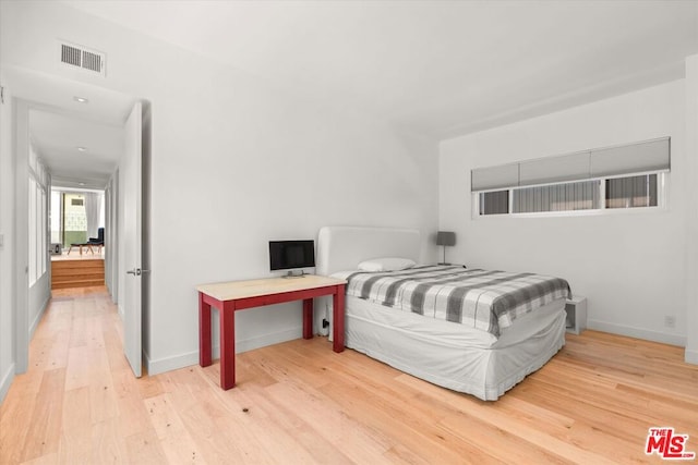 bedroom featuring wood-type flooring