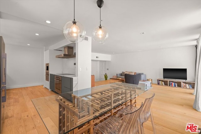 dining area with light hardwood / wood-style floors