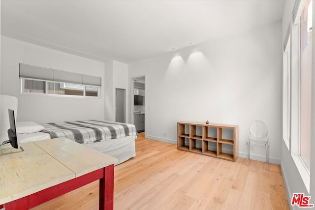 bedroom featuring wood-type flooring