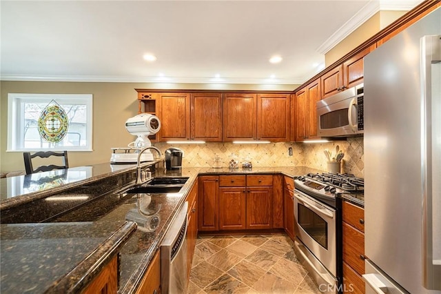 kitchen featuring tasteful backsplash, sink, stainless steel appliances, and dark stone counters