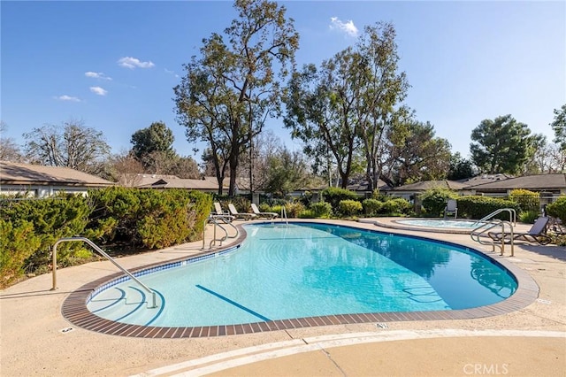 view of swimming pool featuring a patio area