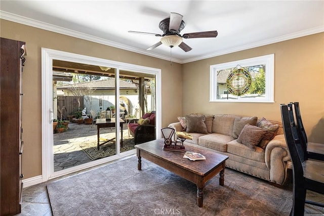 living room with crown molding and ceiling fan