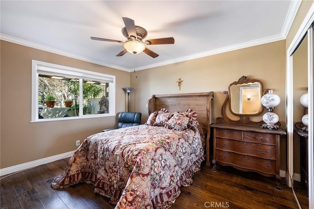 bedroom with a closet, ornamental molding, dark hardwood / wood-style floors, and ceiling fan