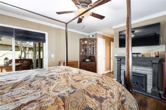 bedroom with crown molding, ceiling fan, access to exterior, and dark wood-type flooring