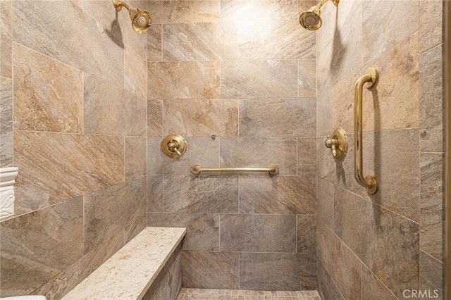 interior details with a tile shower