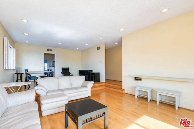 living room with light hardwood / wood-style flooring