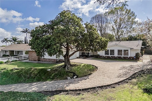 view of front of property with a front lawn