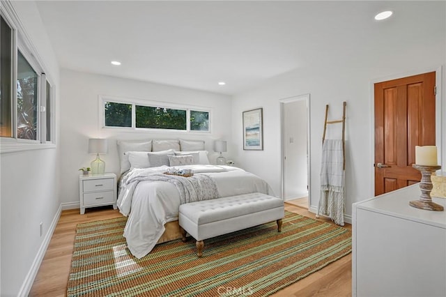 bedroom with light wood-type flooring