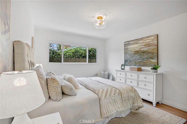 bedroom with light hardwood / wood-style floors