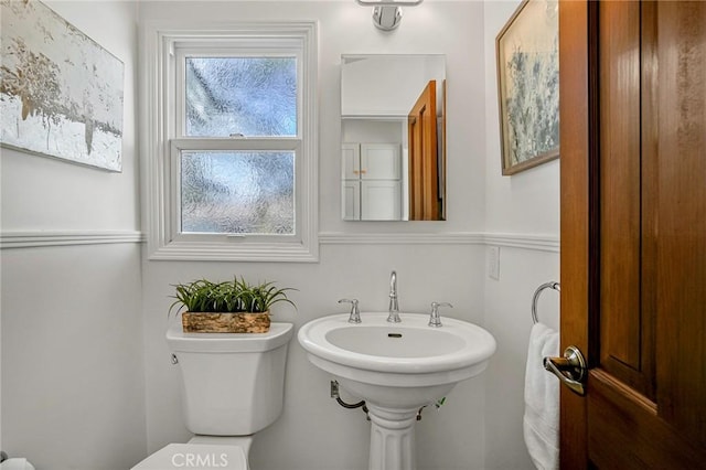 bathroom featuring sink and toilet