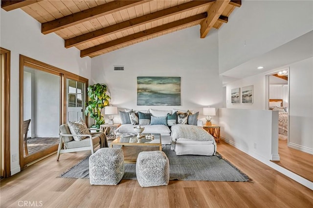 living room with wood ceiling, light hardwood / wood-style floors, and beamed ceiling