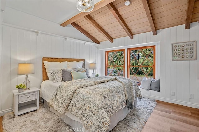 bedroom with wood ceiling, lofted ceiling with beams, and light hardwood / wood-style floors